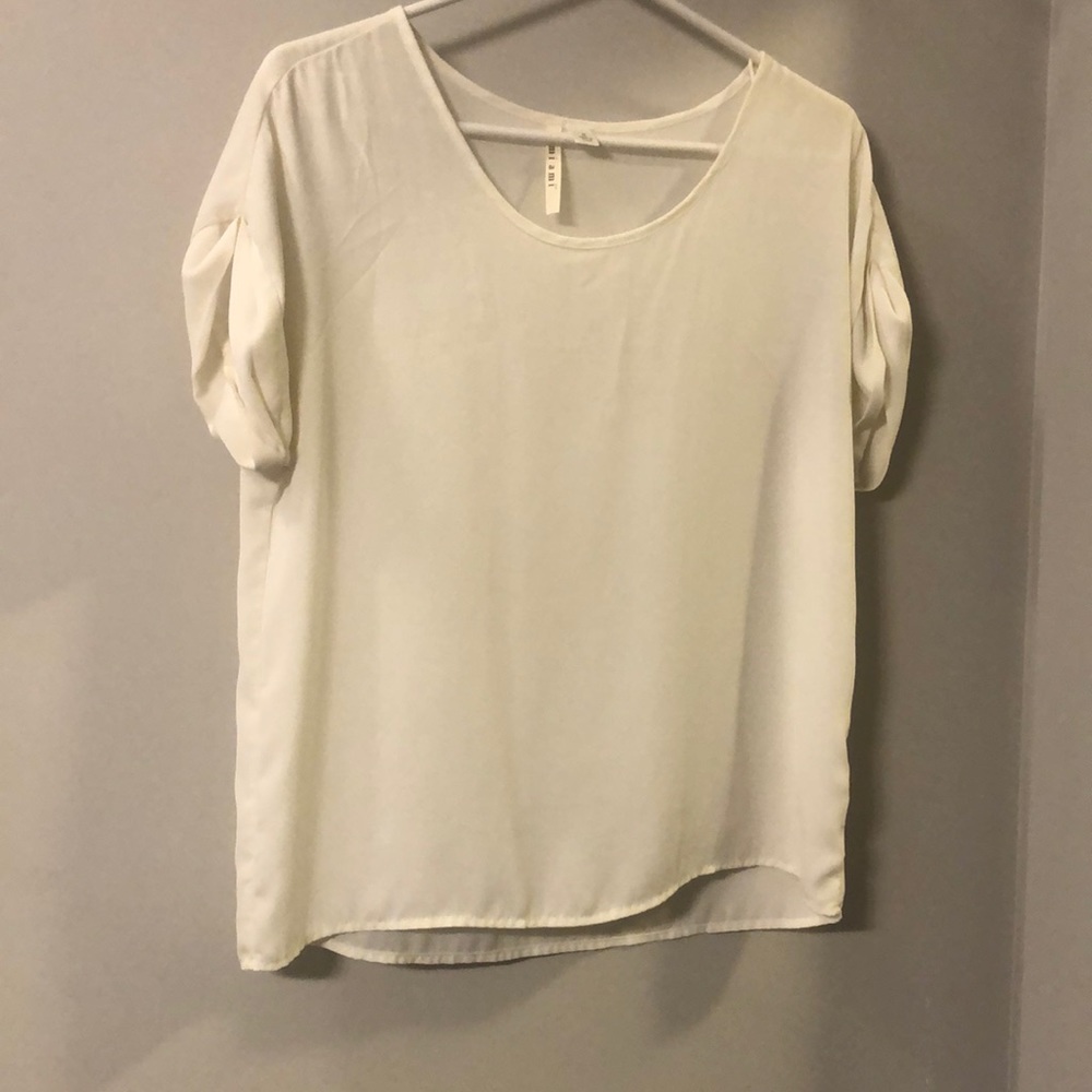 Cream colored short sleeve blouse